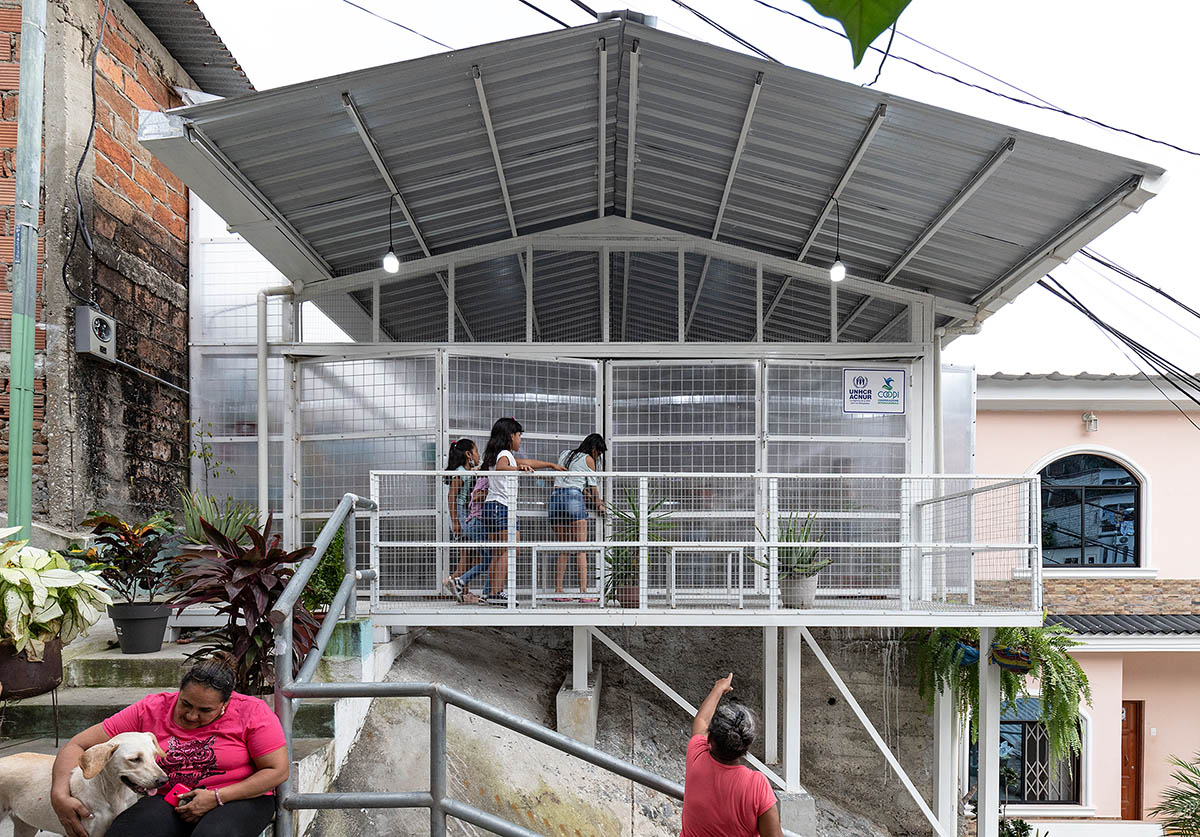 Permeable community house is inserted into Ecuador's existing fabric to serve micro communities 