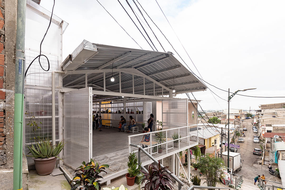Permeable community house is inserted into Ecuador's existing fabric to serve micro communities 