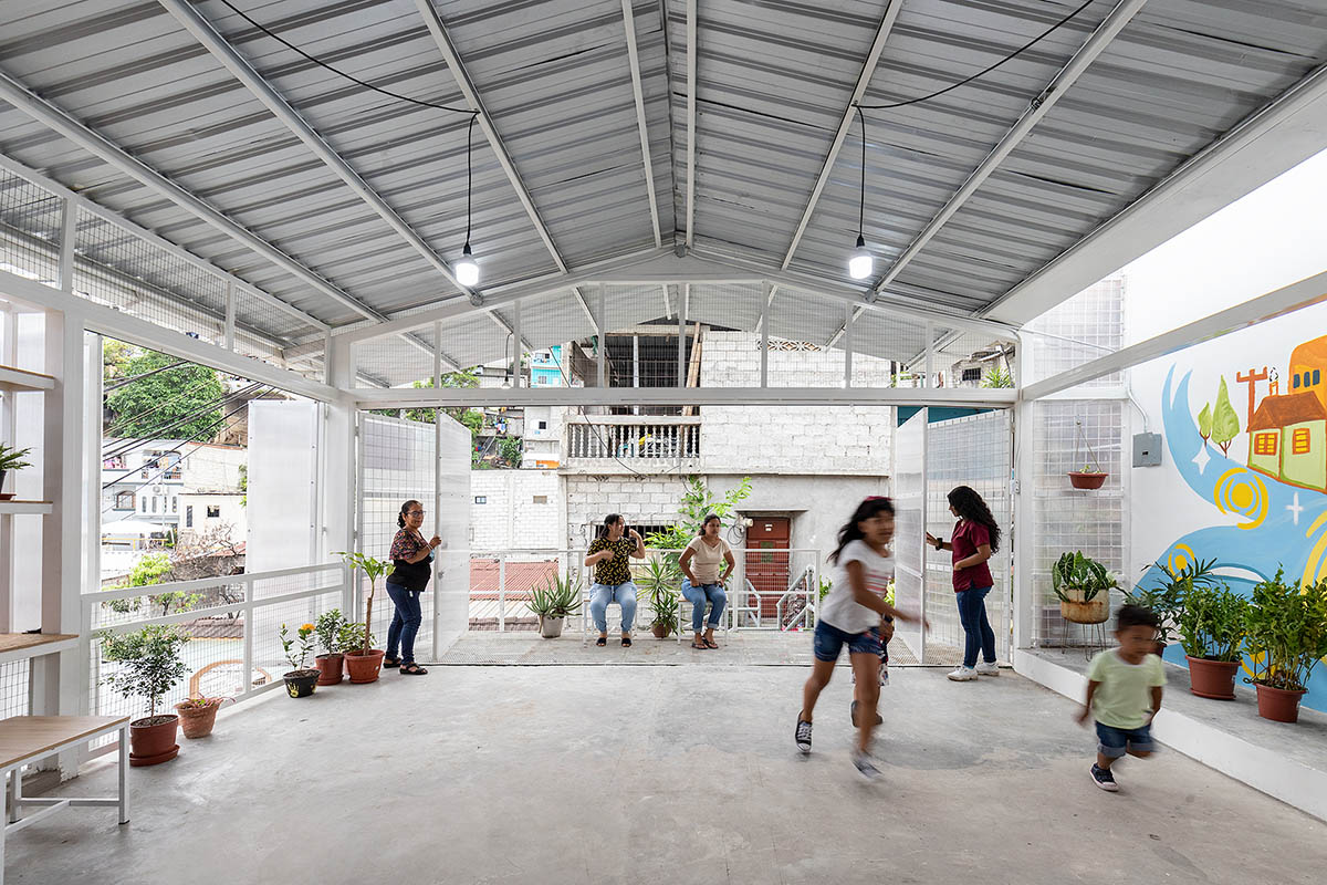 Permeable community house is inserted into Ecuador's existing fabric to serve micro communities 