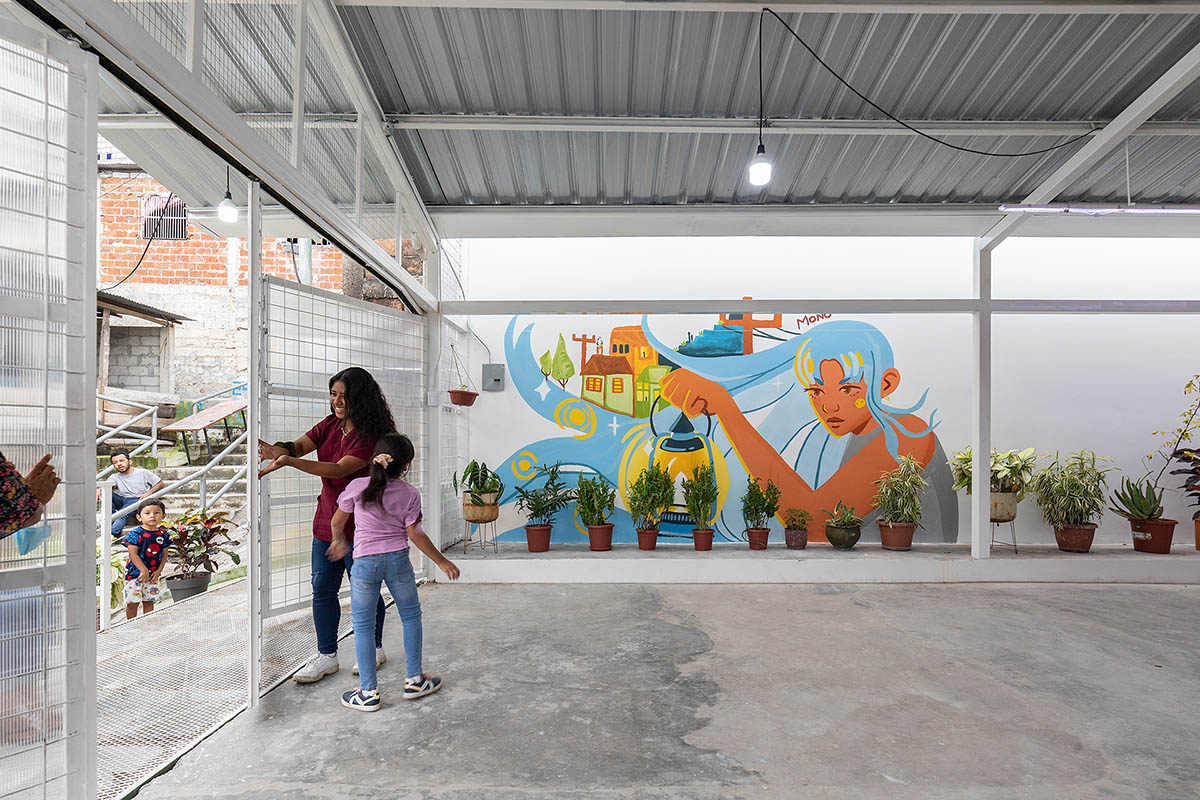 Permeable community house is inserted into Ecuador's existing fabric to serve micro communities 