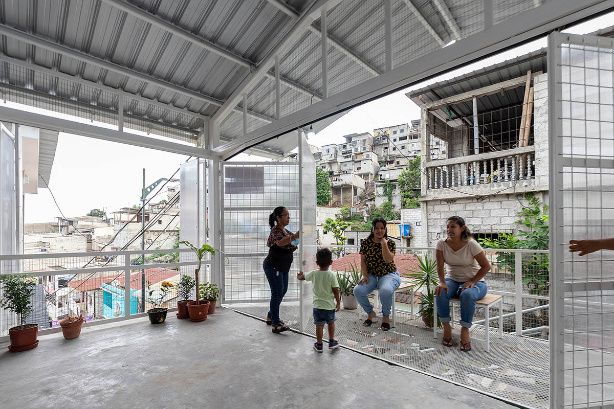 Permeable community house is inserted into Ecuador's existing fabric to serve micro communities 