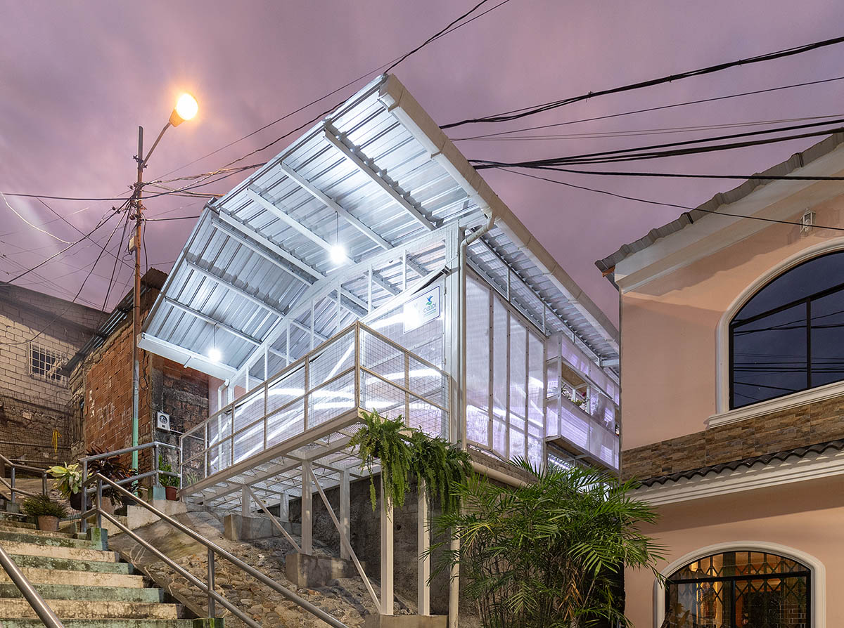 Permeable community house is inserted into Ecuador's existing fabric to serve micro communities 