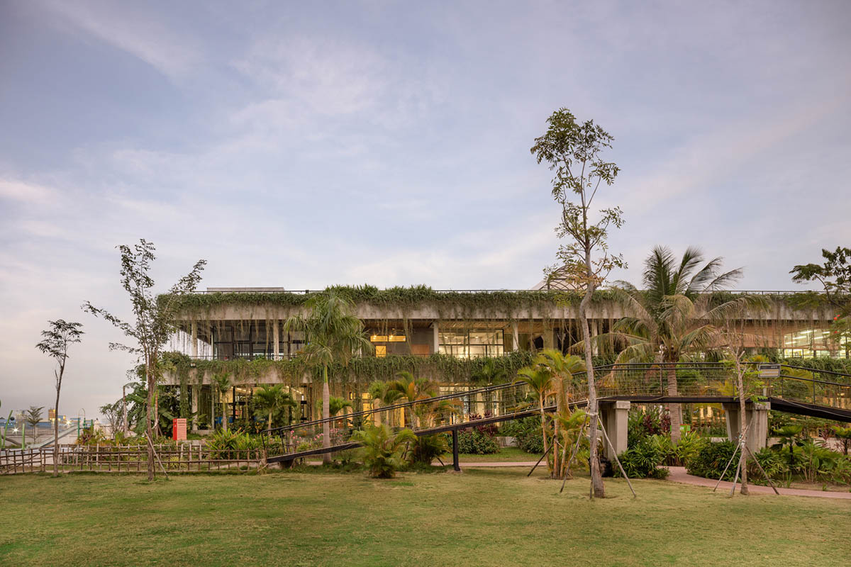 T3 Architects covers façade of Coconut Club in Cambodia with natural curtain made of plants