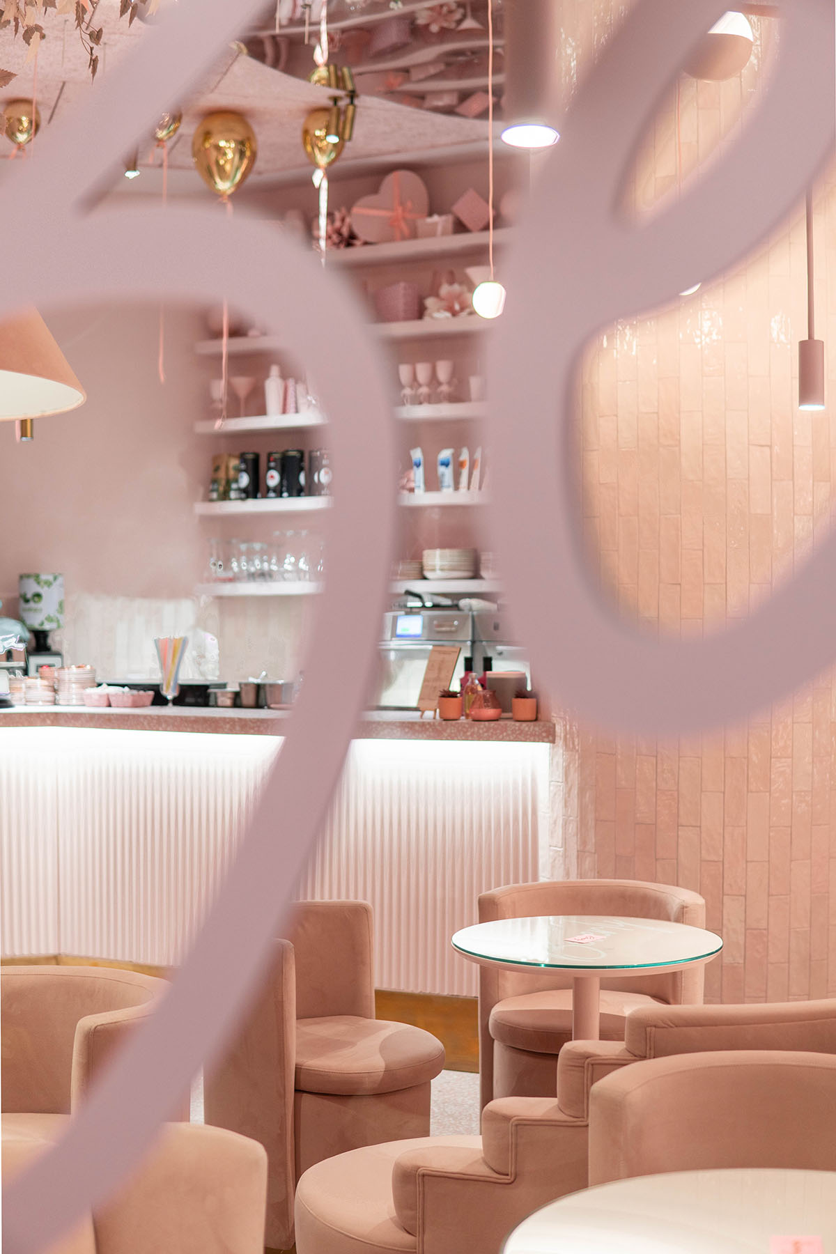 Onlyou Design creates interiors with pinkish geometries and furnitures for Beverly Cafe in Valencia 