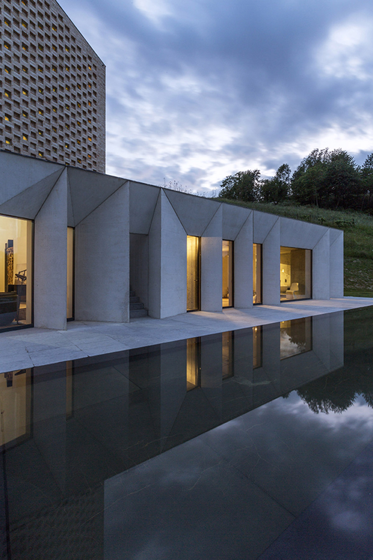 F:L Architetti creates layers of uses in this rural villa and farmhouse on the hills of Italy