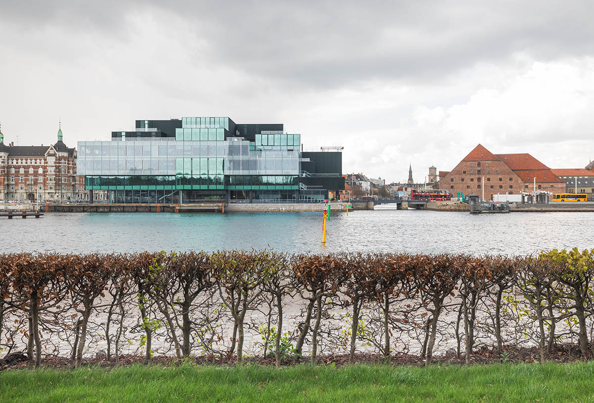 OMA's new cultural hub featuring a stack of green boxes opens in Copenhagen