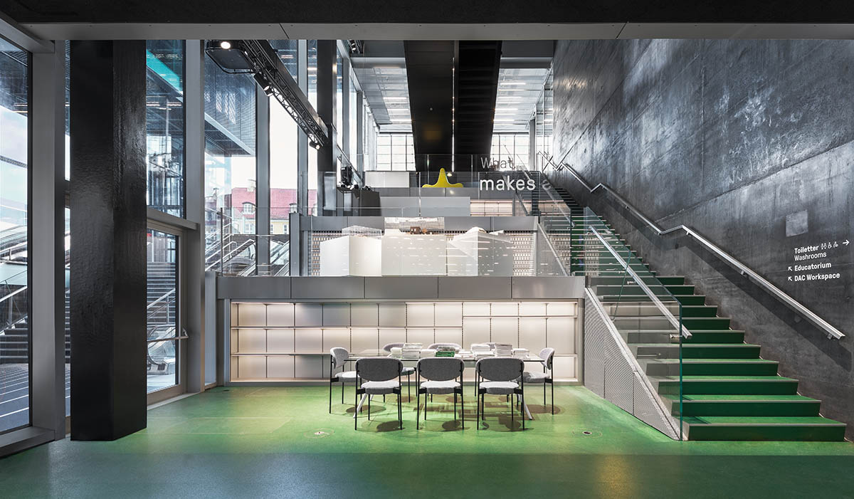 OMA's new cultural hub featuring a stack of green boxes opens in Copenhagen