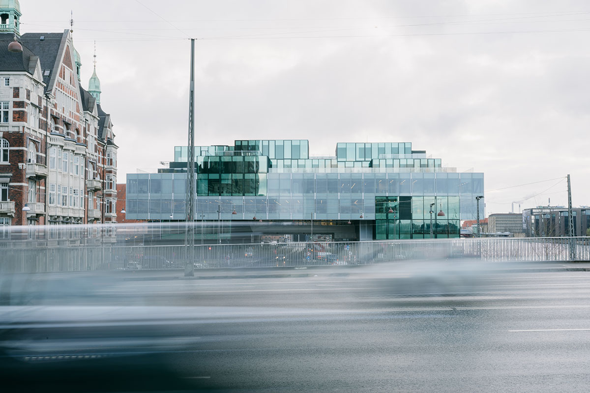 OMA's new cultural hub featuring a stack of green boxes opens in Copenhagen