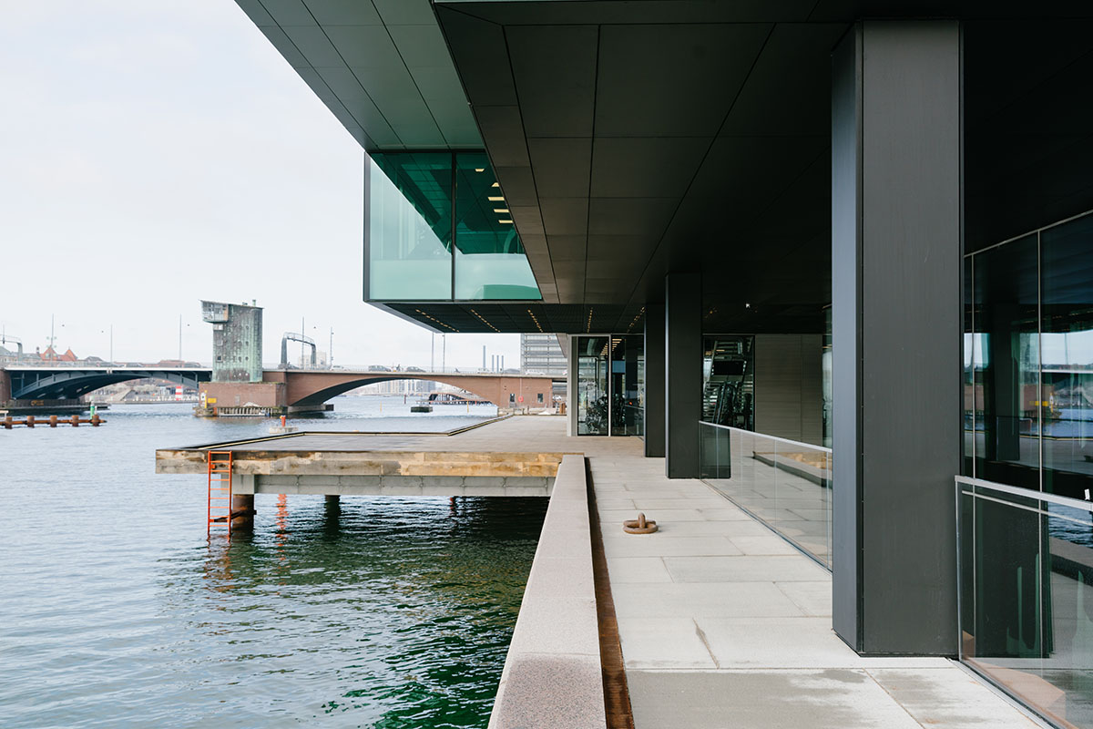 OMA's new cultural hub featuring a stack of green boxes opens in Copenhagen