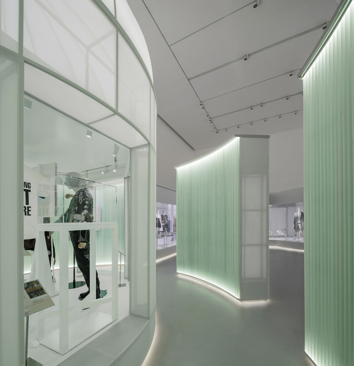Studio 10 designs exhibition space with white tubular structures and black translucent ramps in China