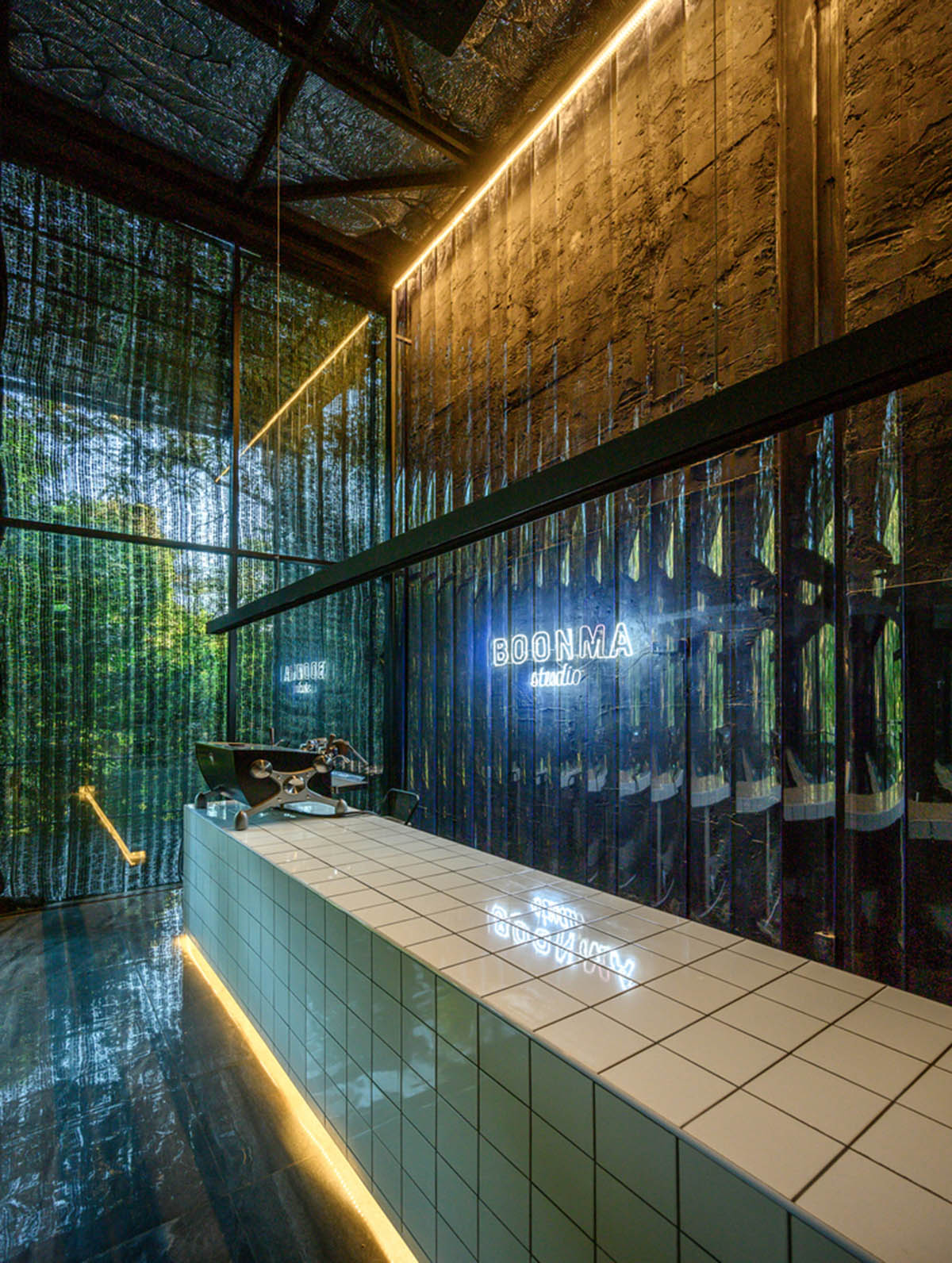 Sher Maker creates cafe from 6-meter opaque curtain wall in a forest in Thailand