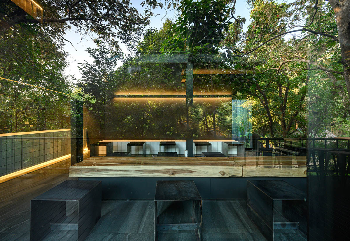Sher Maker creates cafe from 6-meter opaque curtain wall in a forest in Thailand