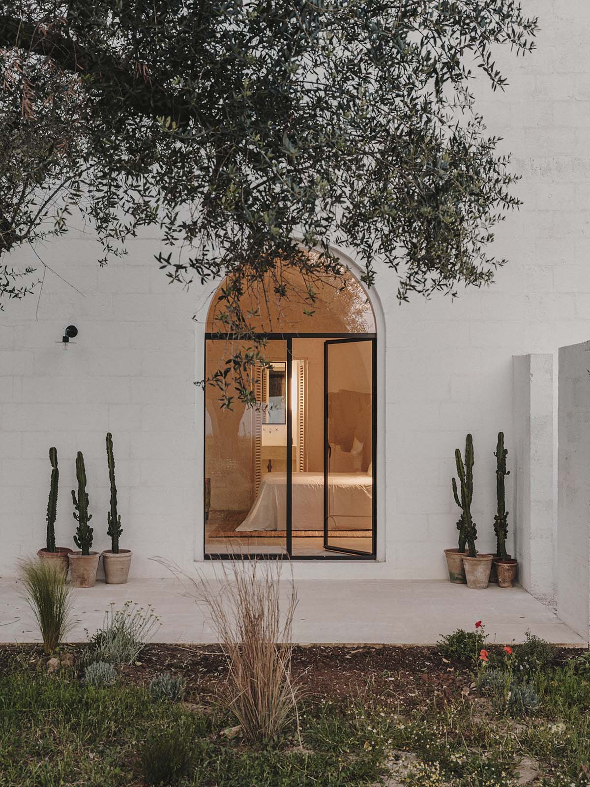 Studio Andrew Trotter converts three white stone country houses into bed and breakfast in Oria