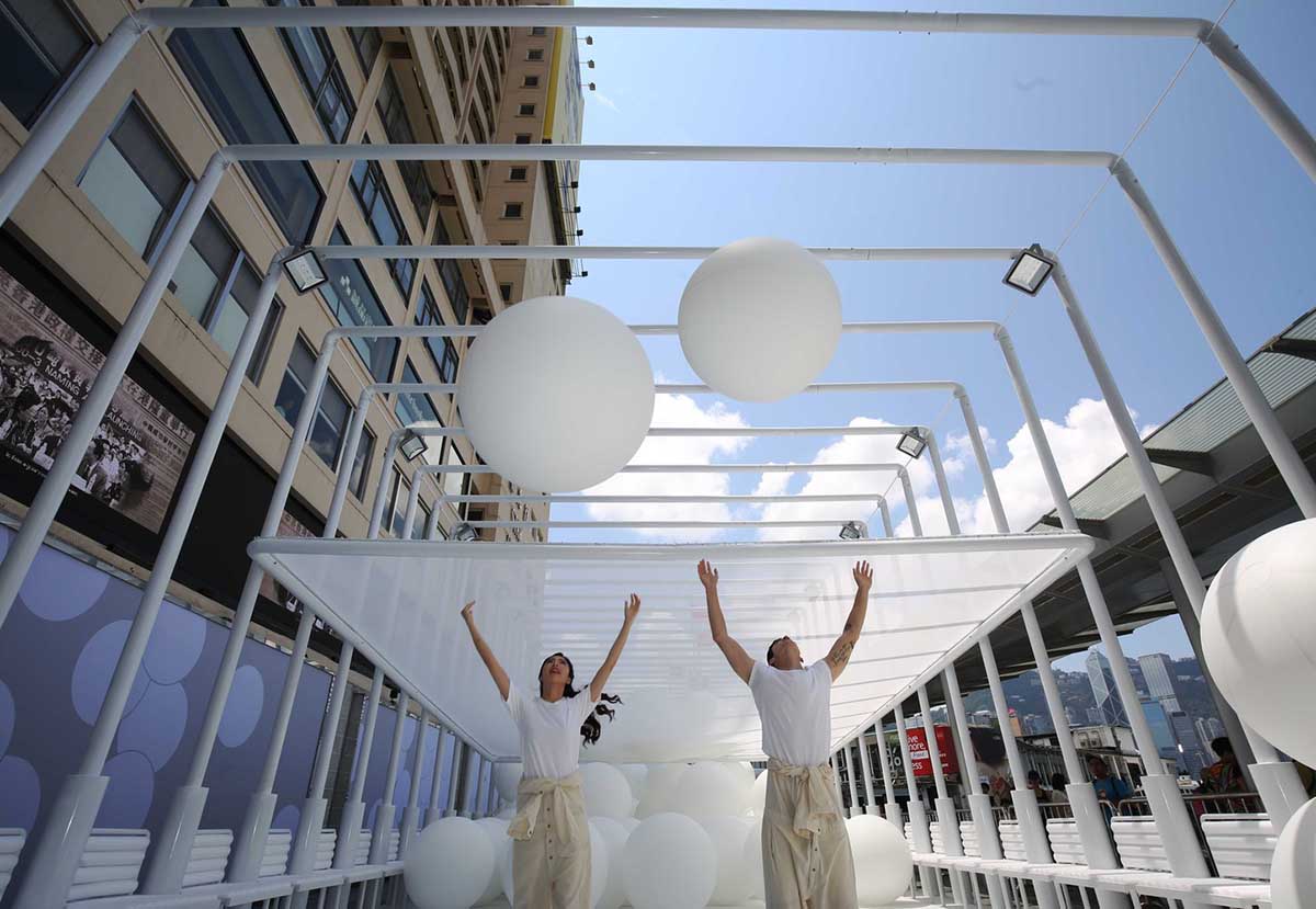 Snarkitecture fills giant steel cage with white bouncy balls at Harbour City of Hong Kong