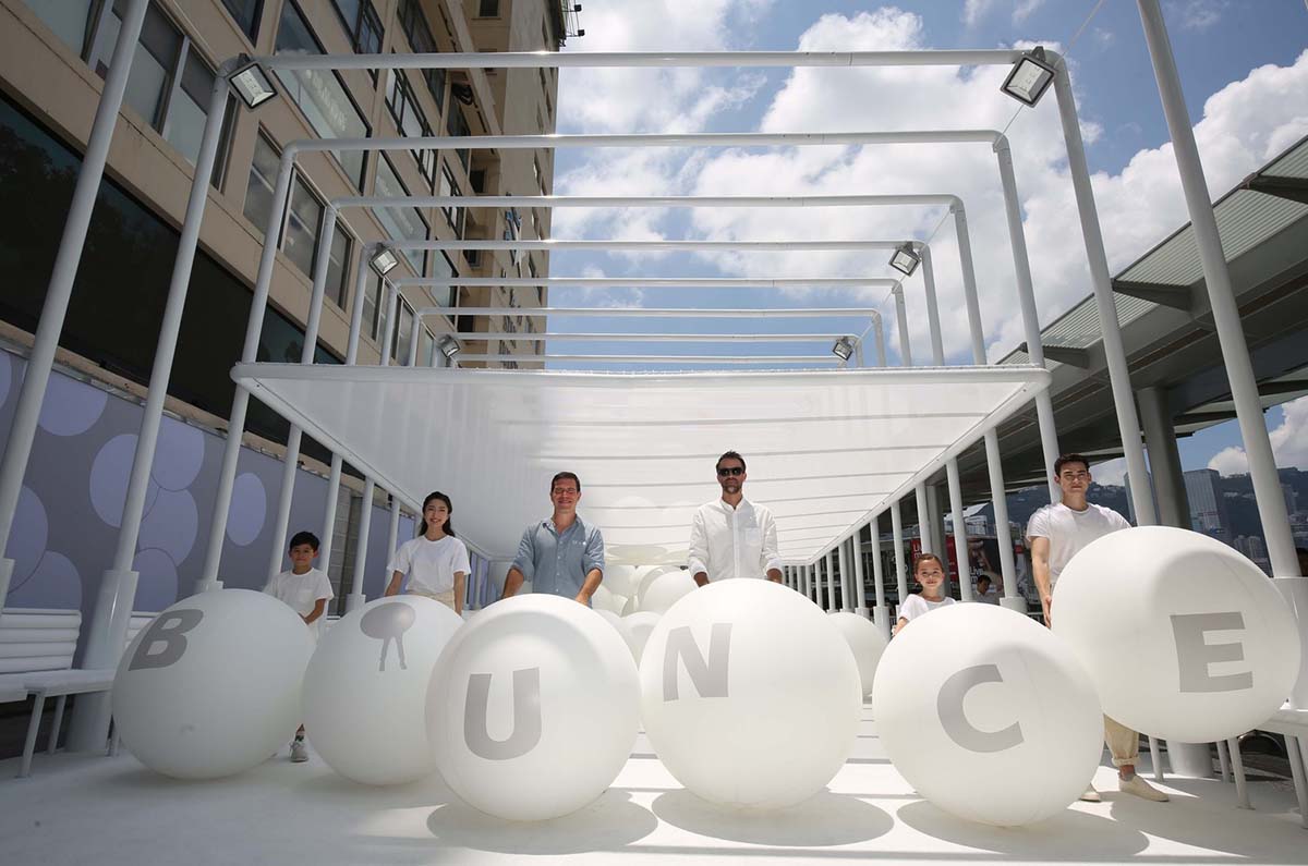 Snarkitecture fills giant steel cage with white bouncy balls at Harbour City of Hong Kong