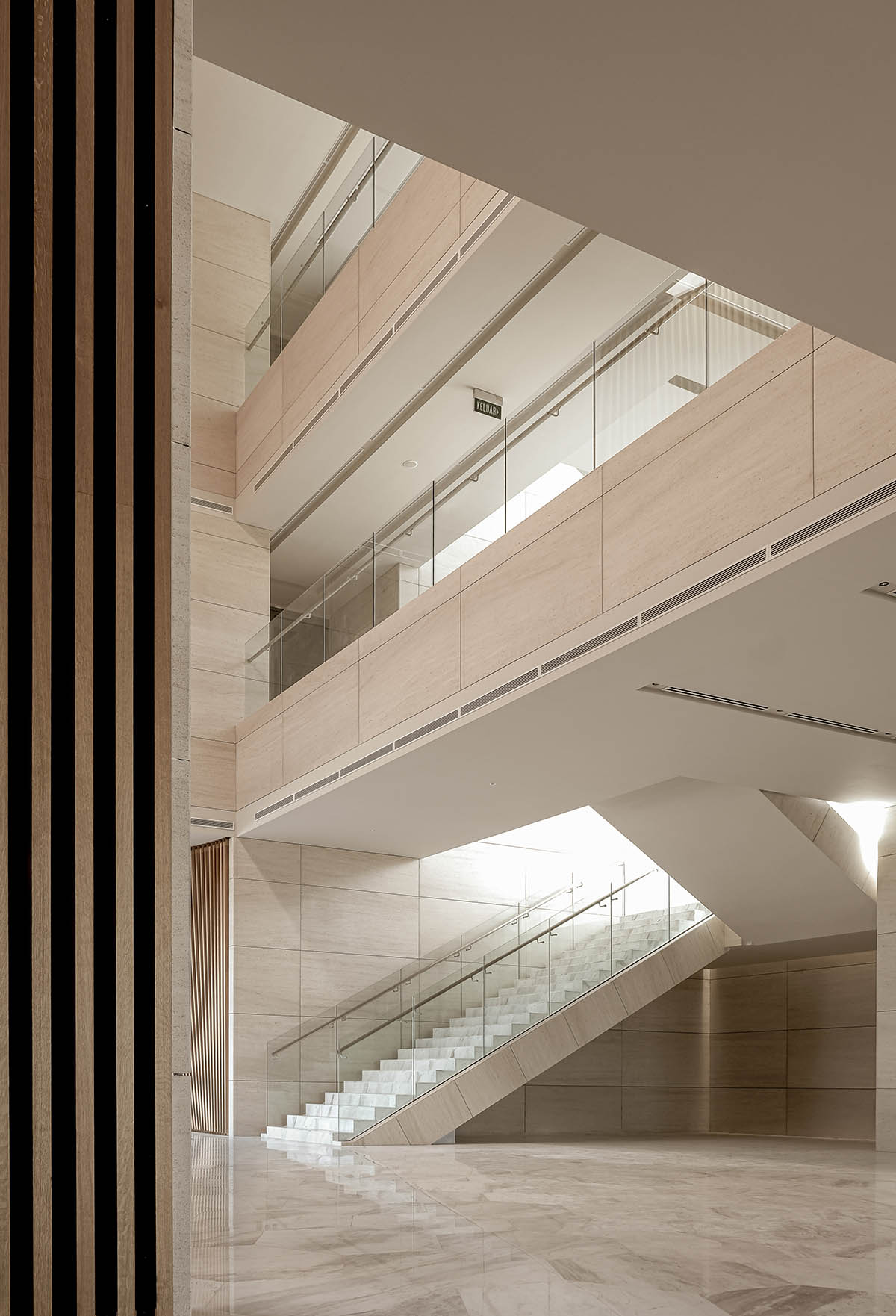 The interior of the Kuwait Embassy creates an inviting and warm atmosphere, designed by Architectkidd