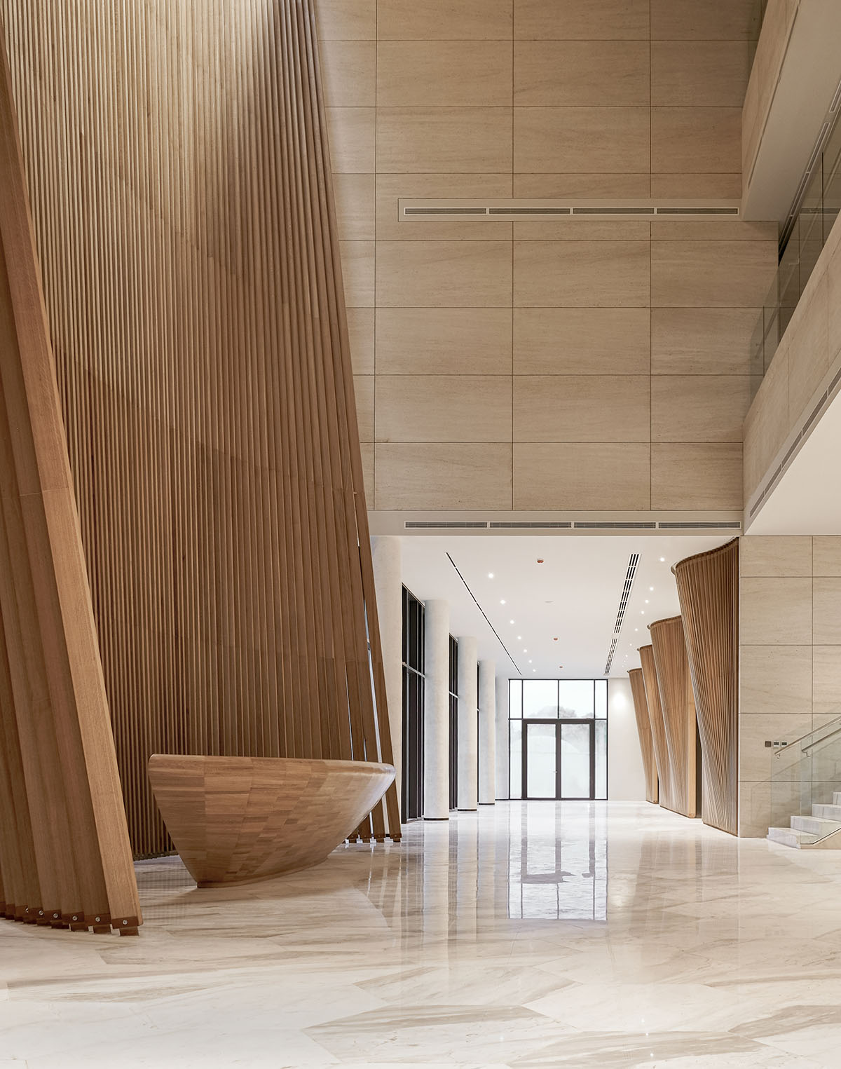 The interior of the Kuwait Embassy creates an inviting and warm atmosphere, designed by Architectkidd