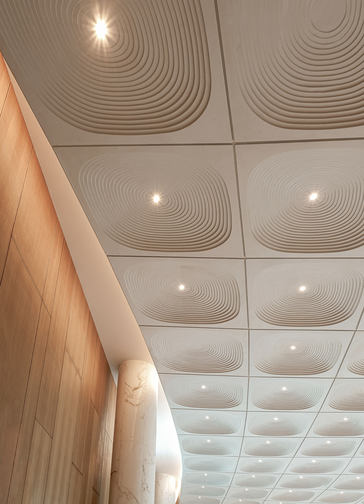 The interior of the Kuwait Embassy creates an inviting and warm atmosphere, designed by Architectkidd