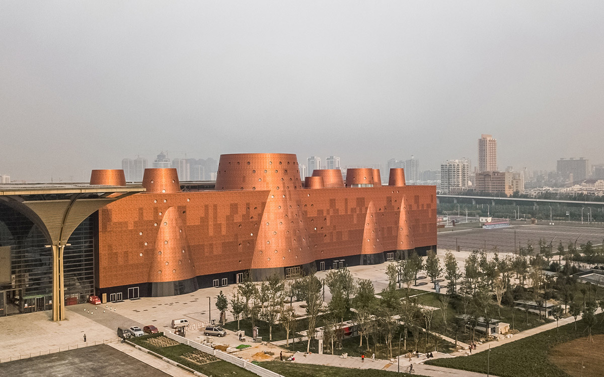 Bernard Tschumi's Exploratorium features copper-clad cones addressing Tianjin's industrial past