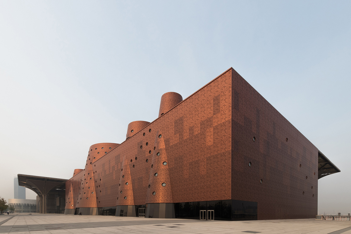 Bernard Tschumi's Exploratorium features copper-clad cones addressing Tianjin's industrial past