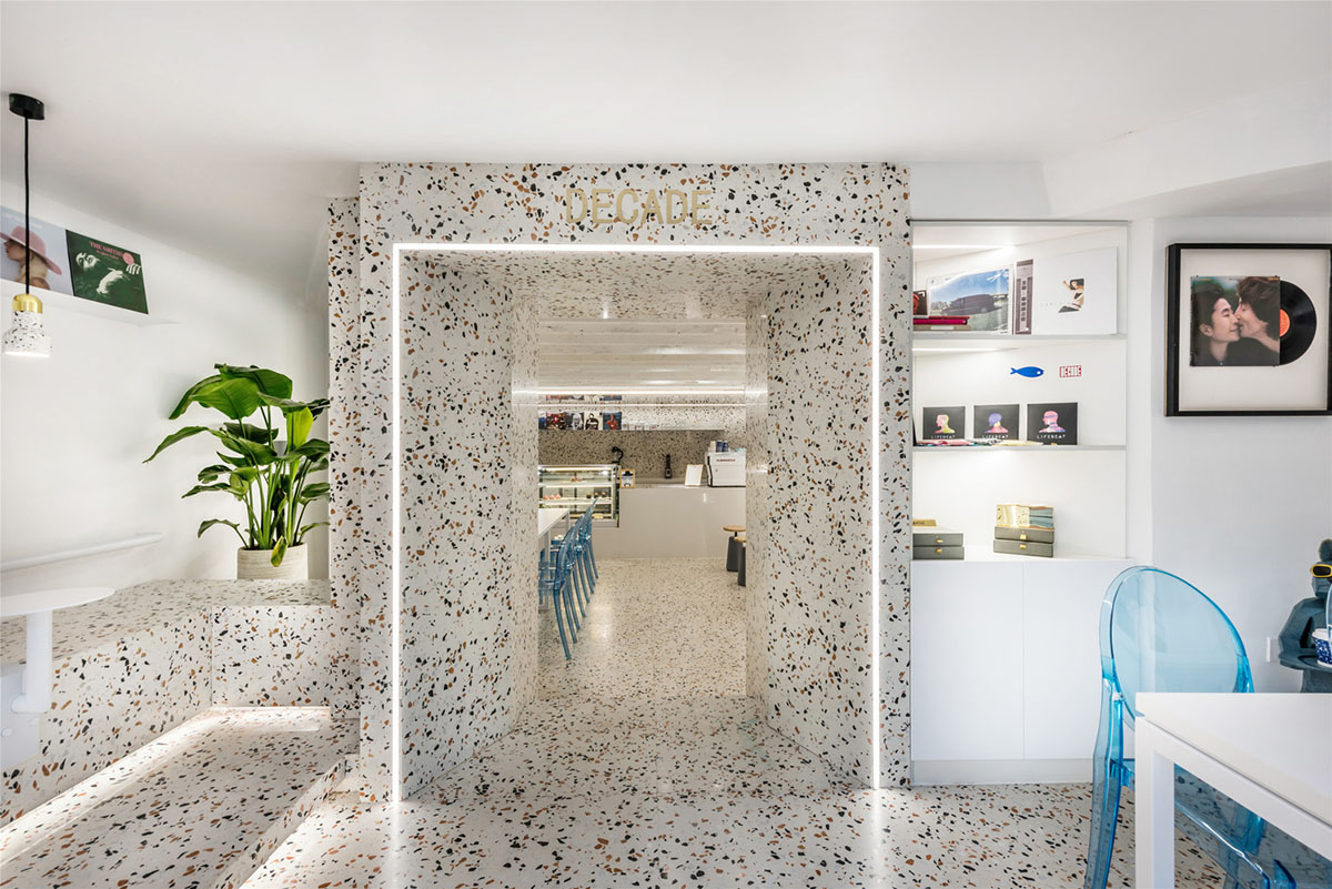 This tiny cafe by TOUCH Design is dotted with white and orange interwoven terrazzo details in Tianjin