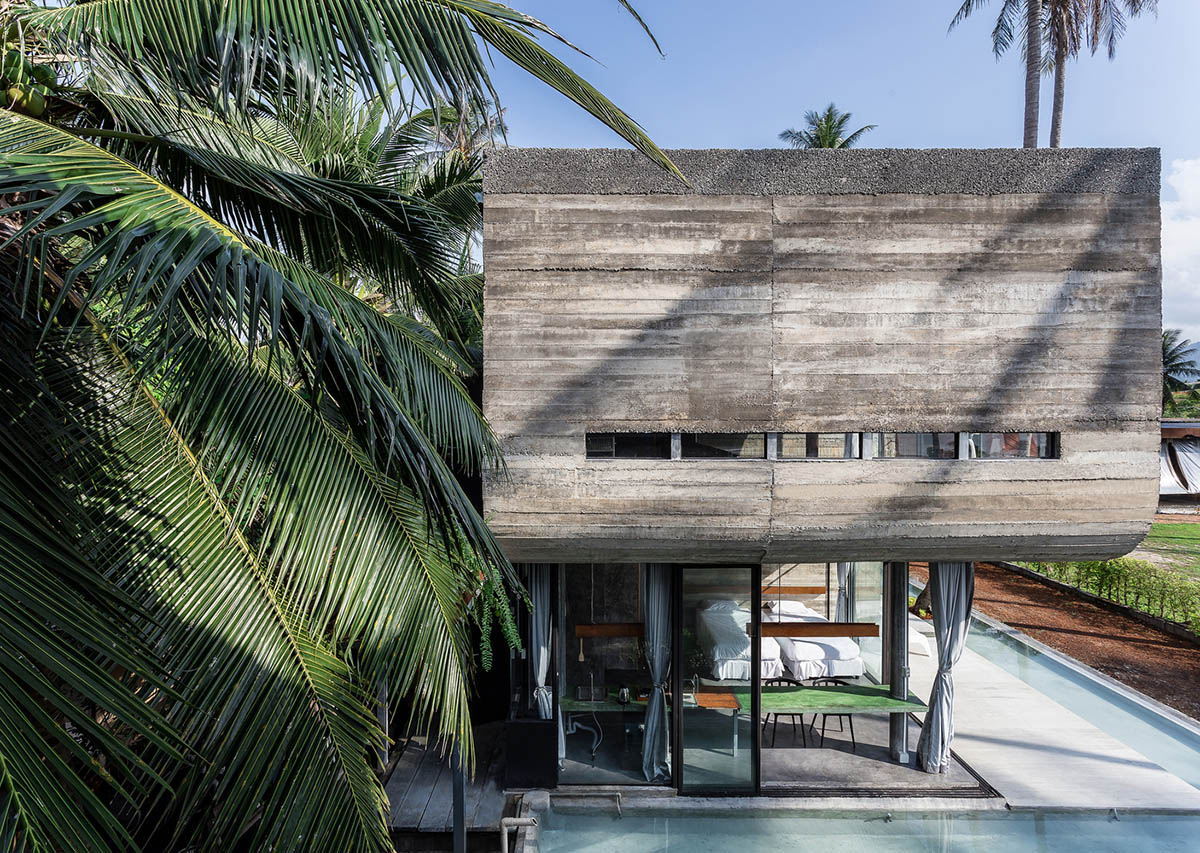 S-shaped concrete slabs form this Bunjob House by NPDA Studio at Phangan island in Thailand