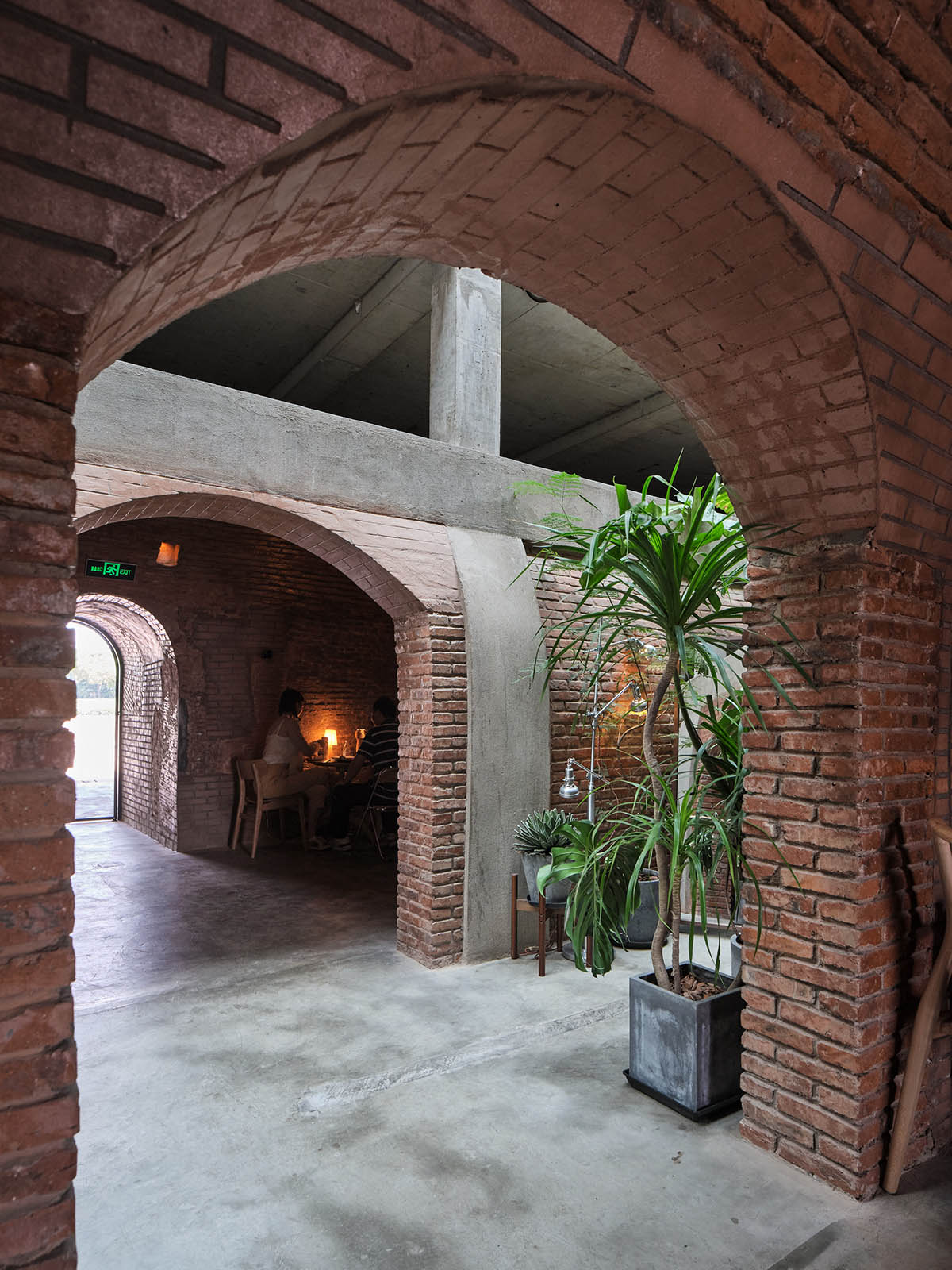 Thick brick walls redefine a historic kiln as a public space and multi-purpose hall in Pudong