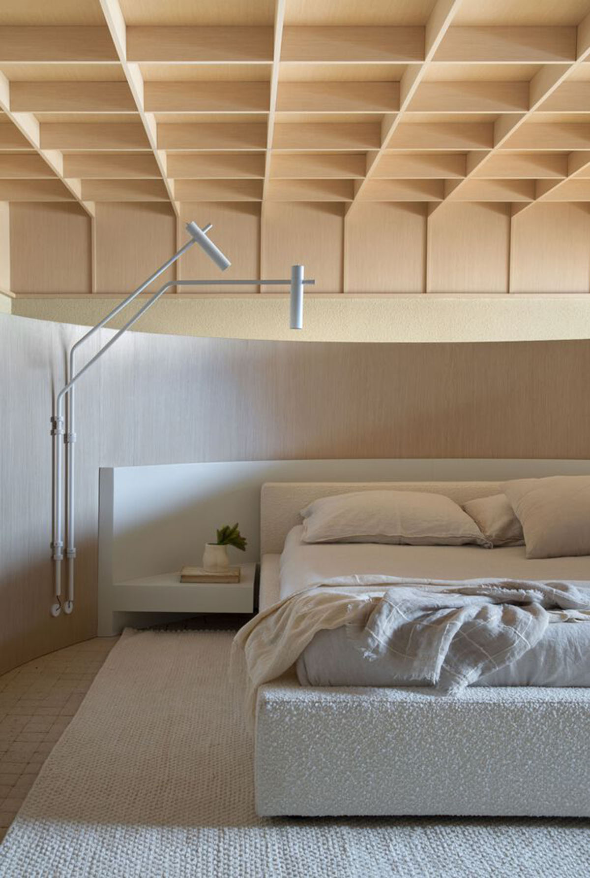 Organic shapes and bulbous furnitures form interiors of Olaria House by NJ+ Arquitetos Associados 