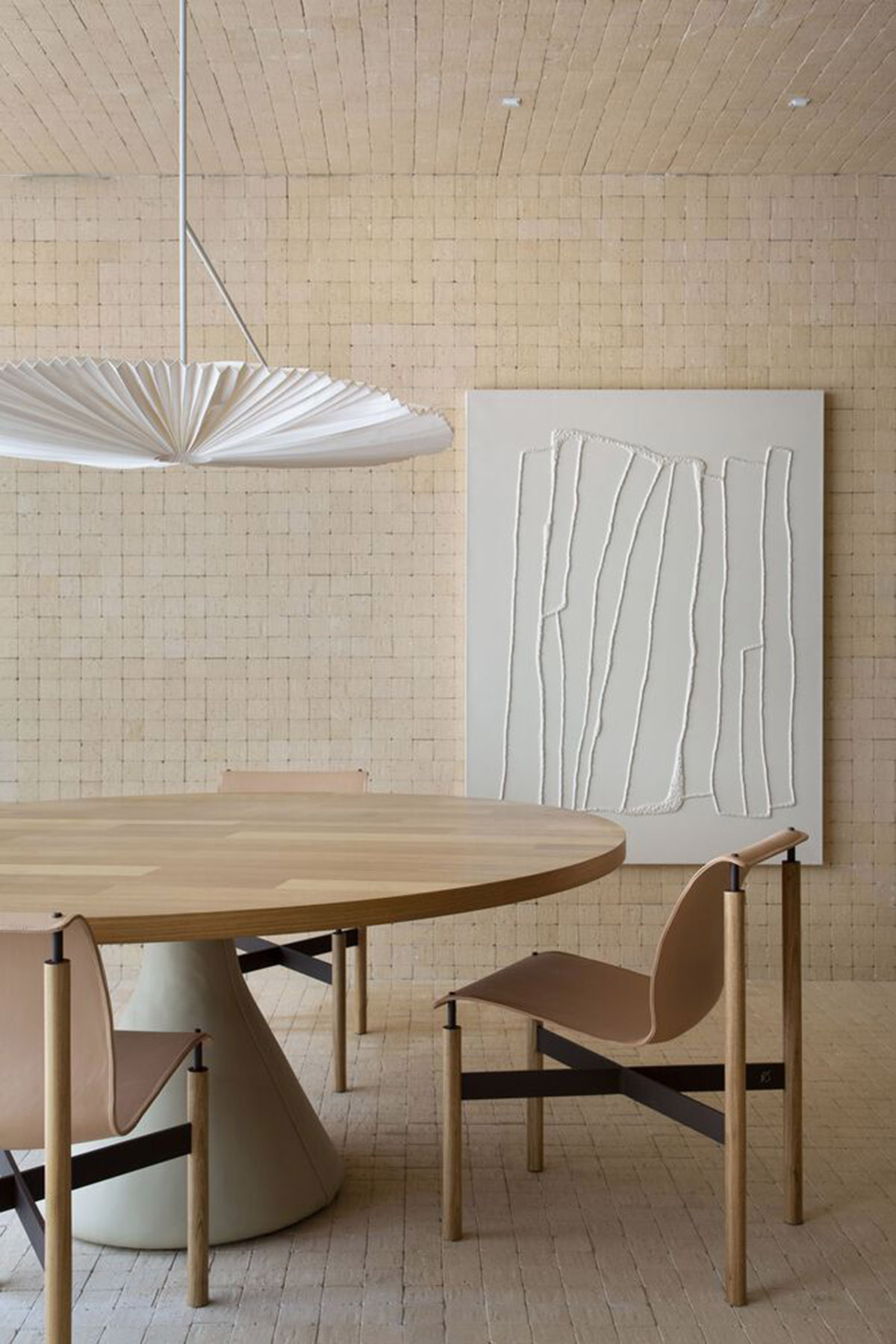 Organic shapes and bulbous furnitures form interiors of Olaria House by NJ+ Arquitetos Associados 