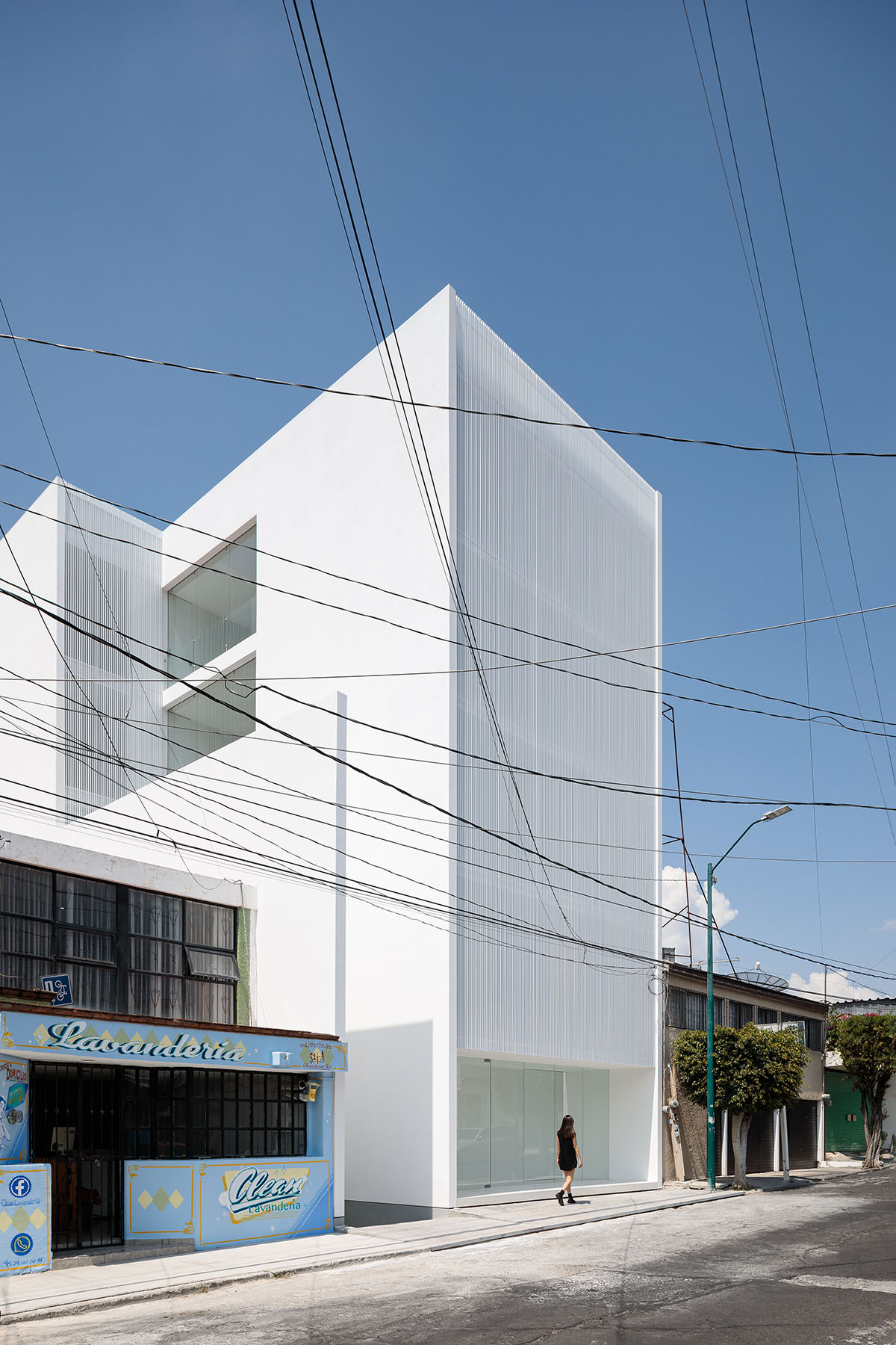 HW Studio adds lacework-looking façade to all-white house in Mexico