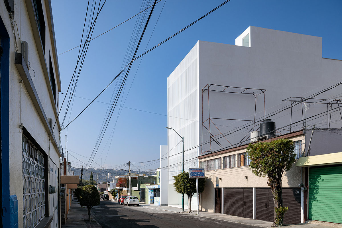 HW Studio adds lacework-looking façade to all-white house in Mexico