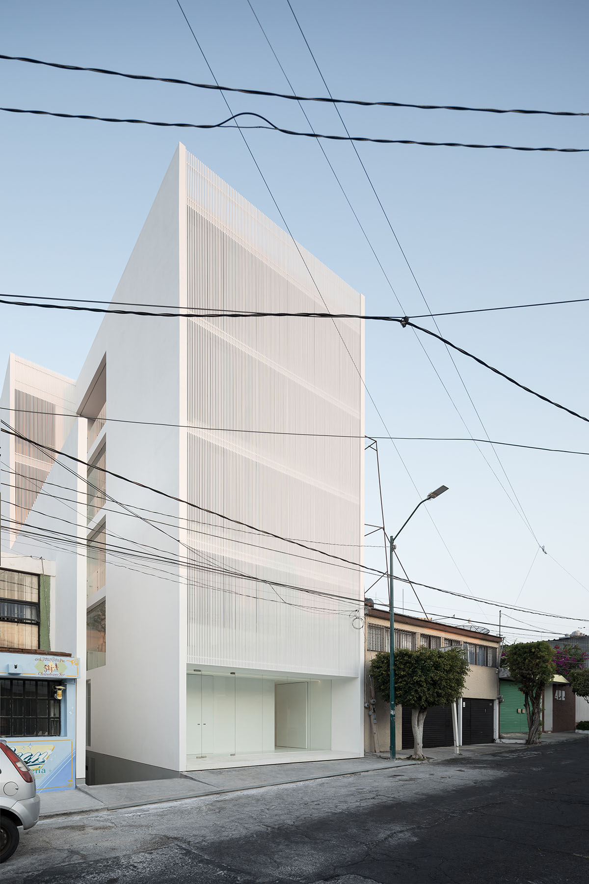 HW Studio adds lacework-looking façade to all-white house in Mexico