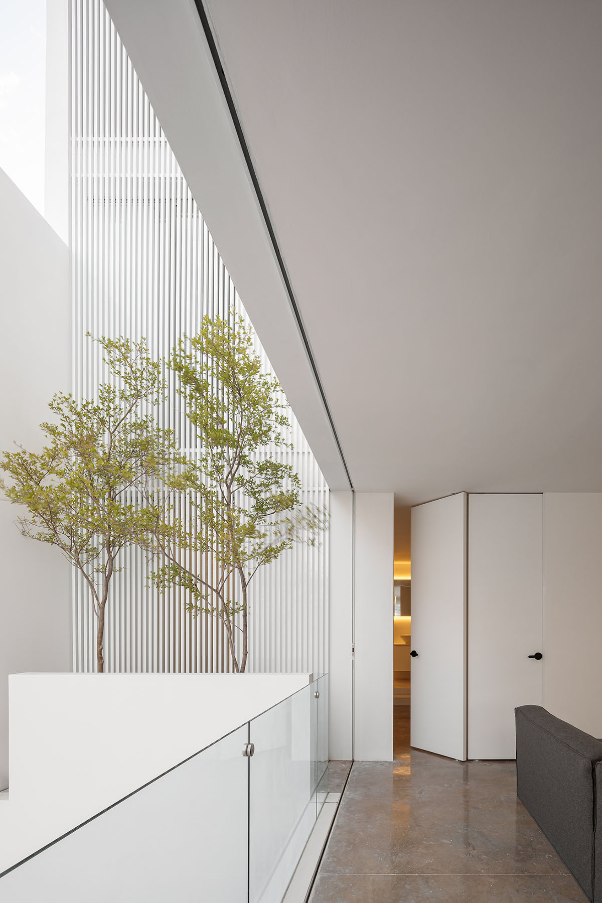 HW Studio adds lacework-looking façade to all-white house in Mexico