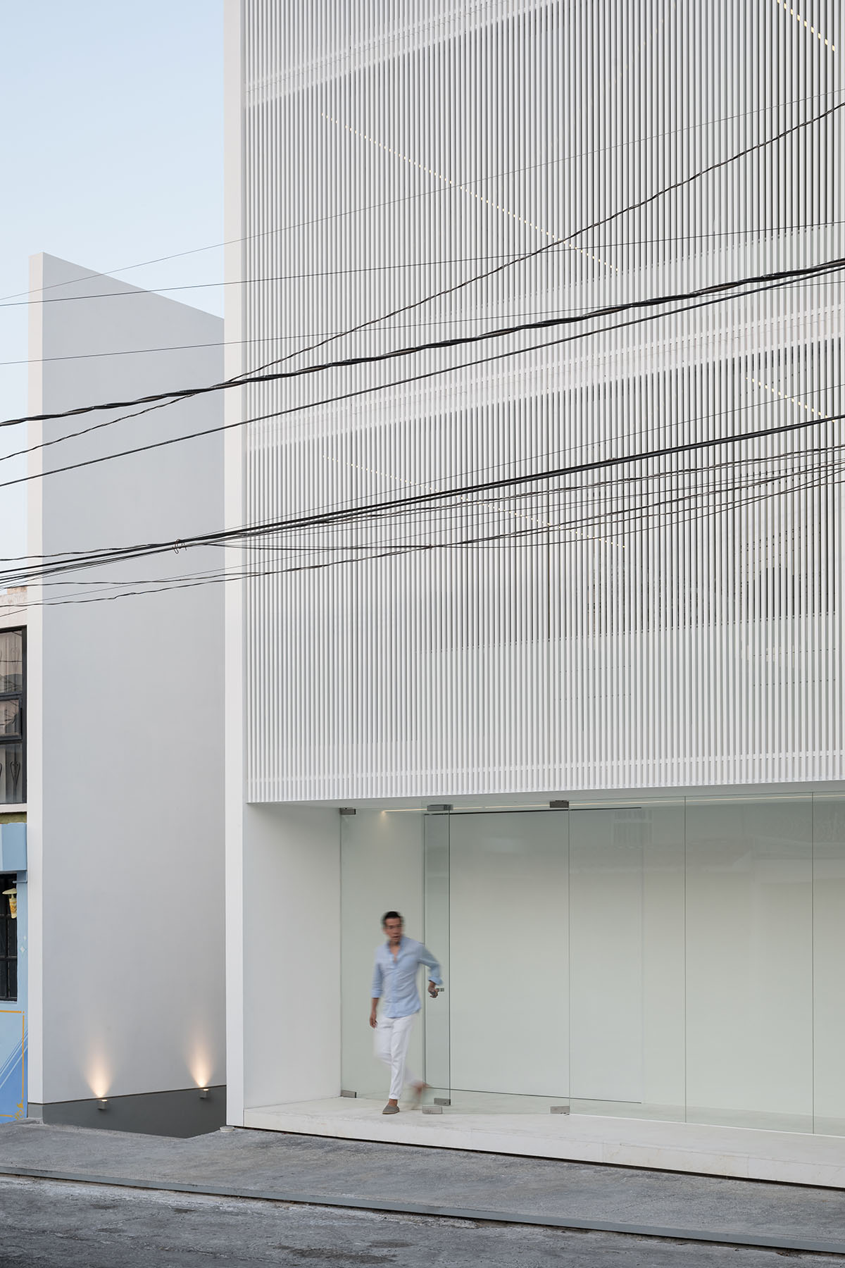HW Studio adds lacework-looking façade to all-white house in Mexico