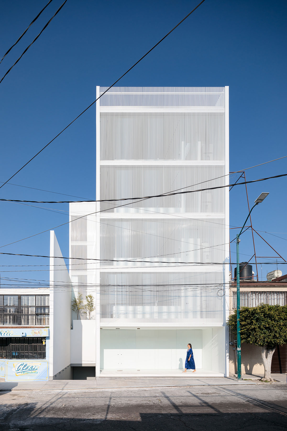 HW Studio adds lacework-looking façade to all-white house in Mexico