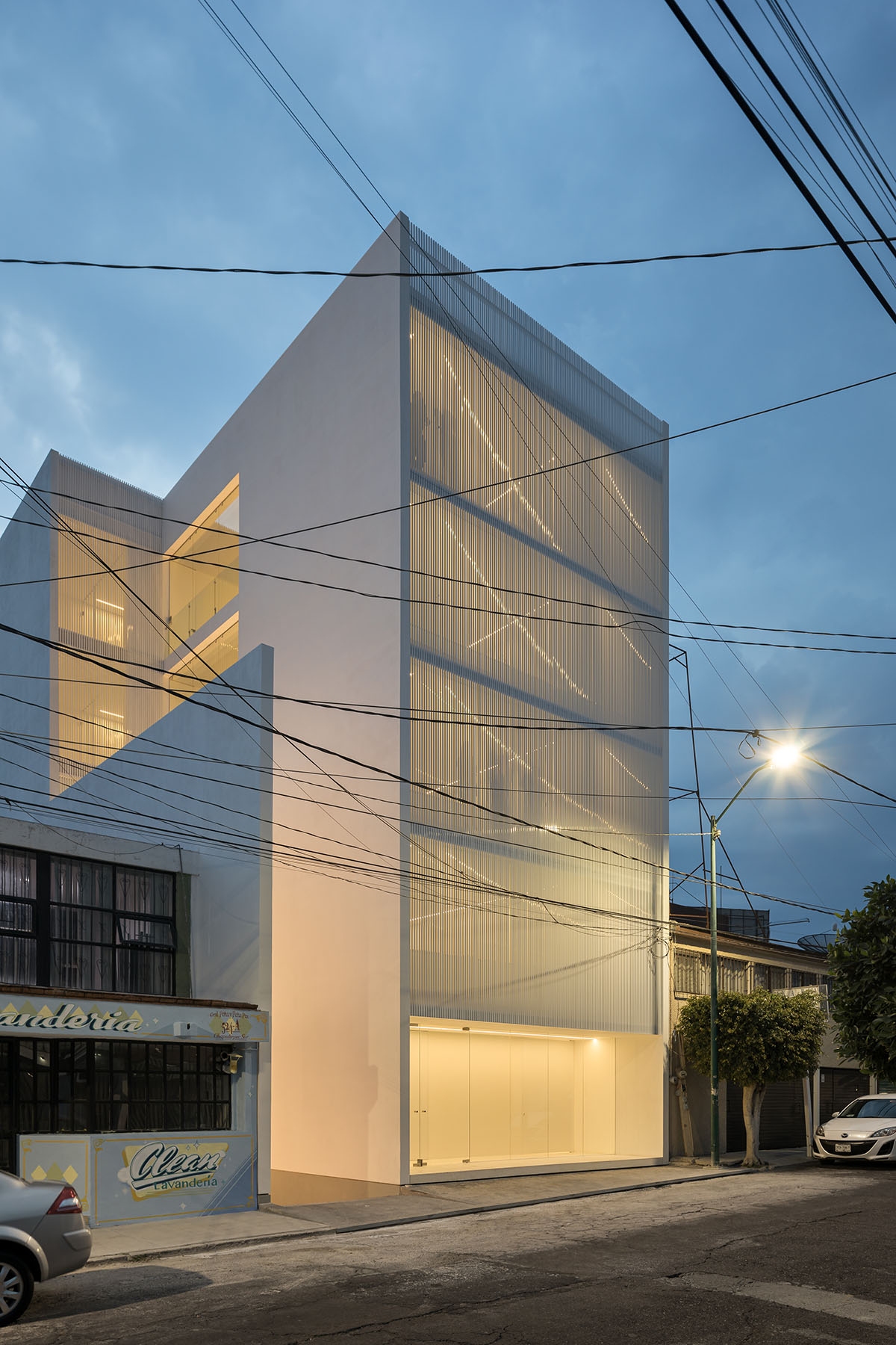 HW Studio adds lacework-looking façade to all-white house in Mexico