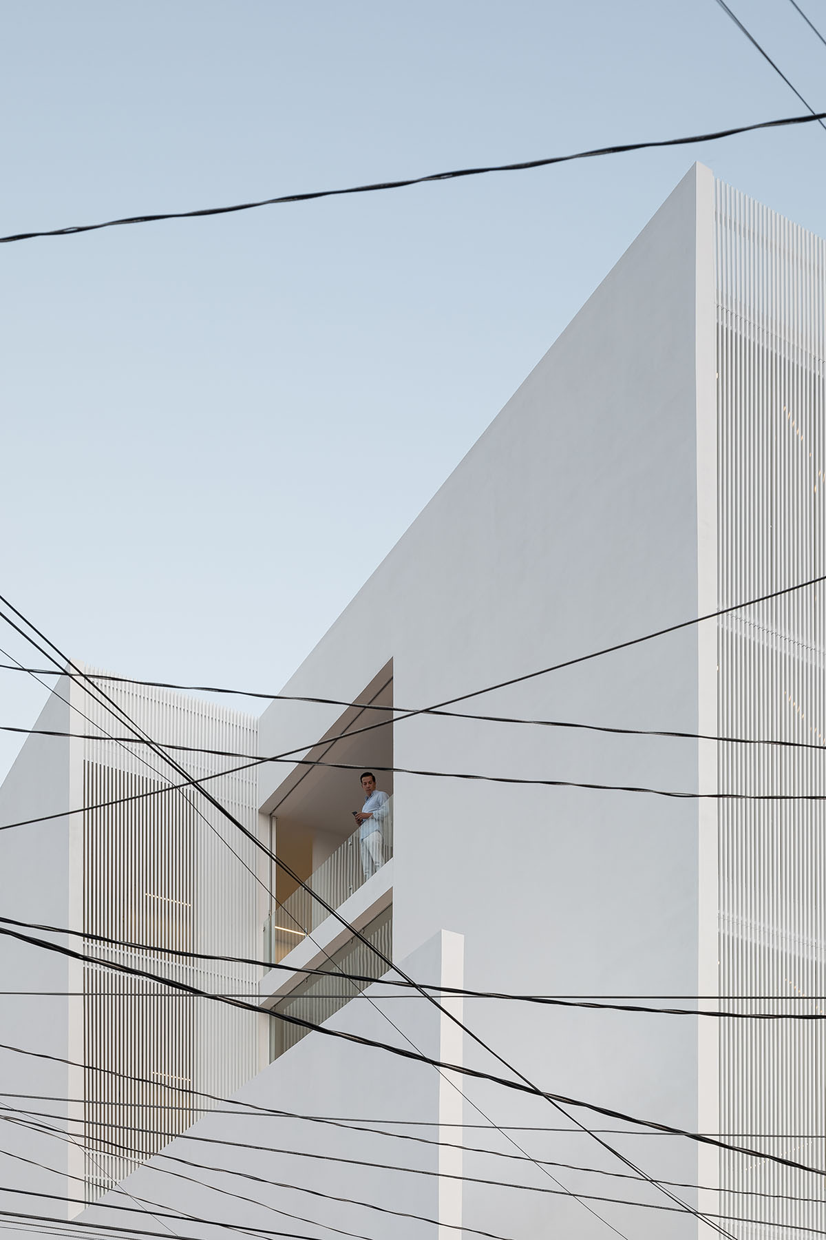 HW Studio adds lacework-looking façade to all-white house in Mexico