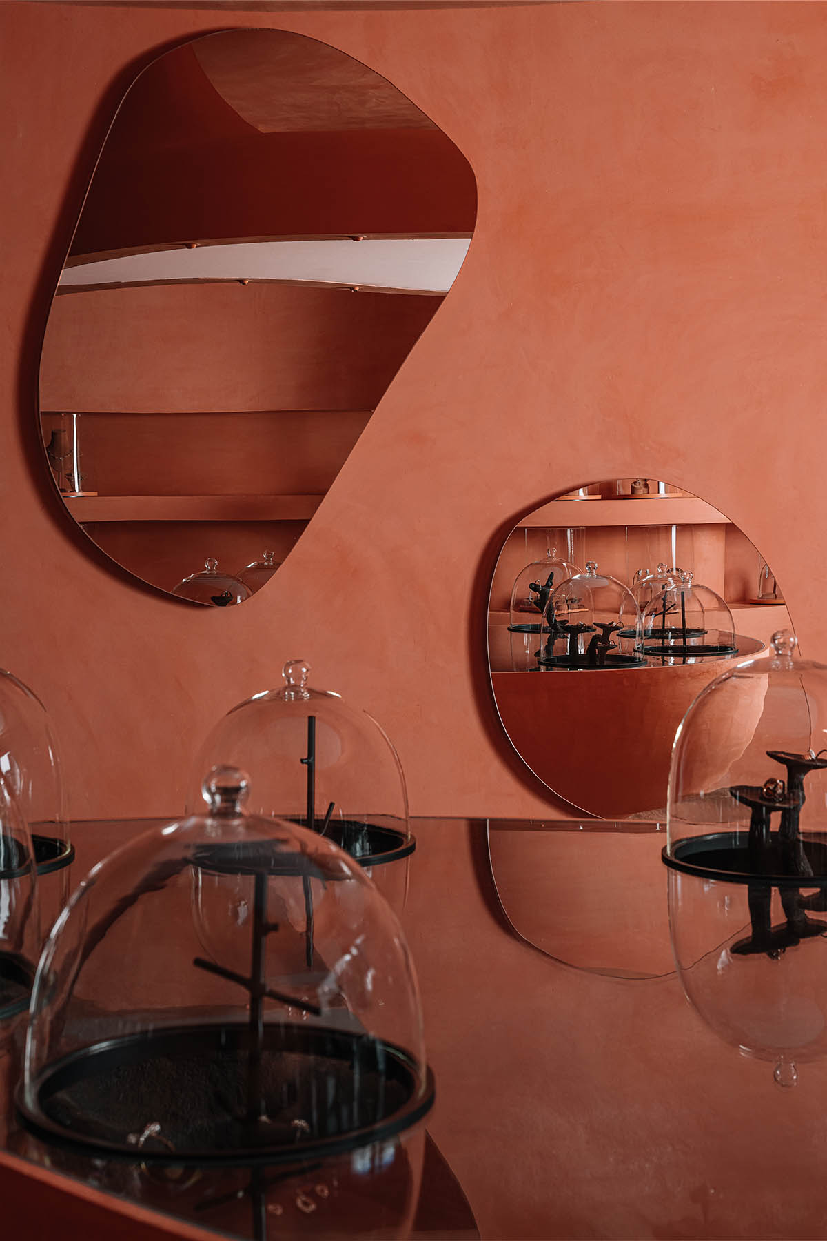 Indian jewellery boutique by MuseLAB features terracotta-doused interiors creating a sinuous island