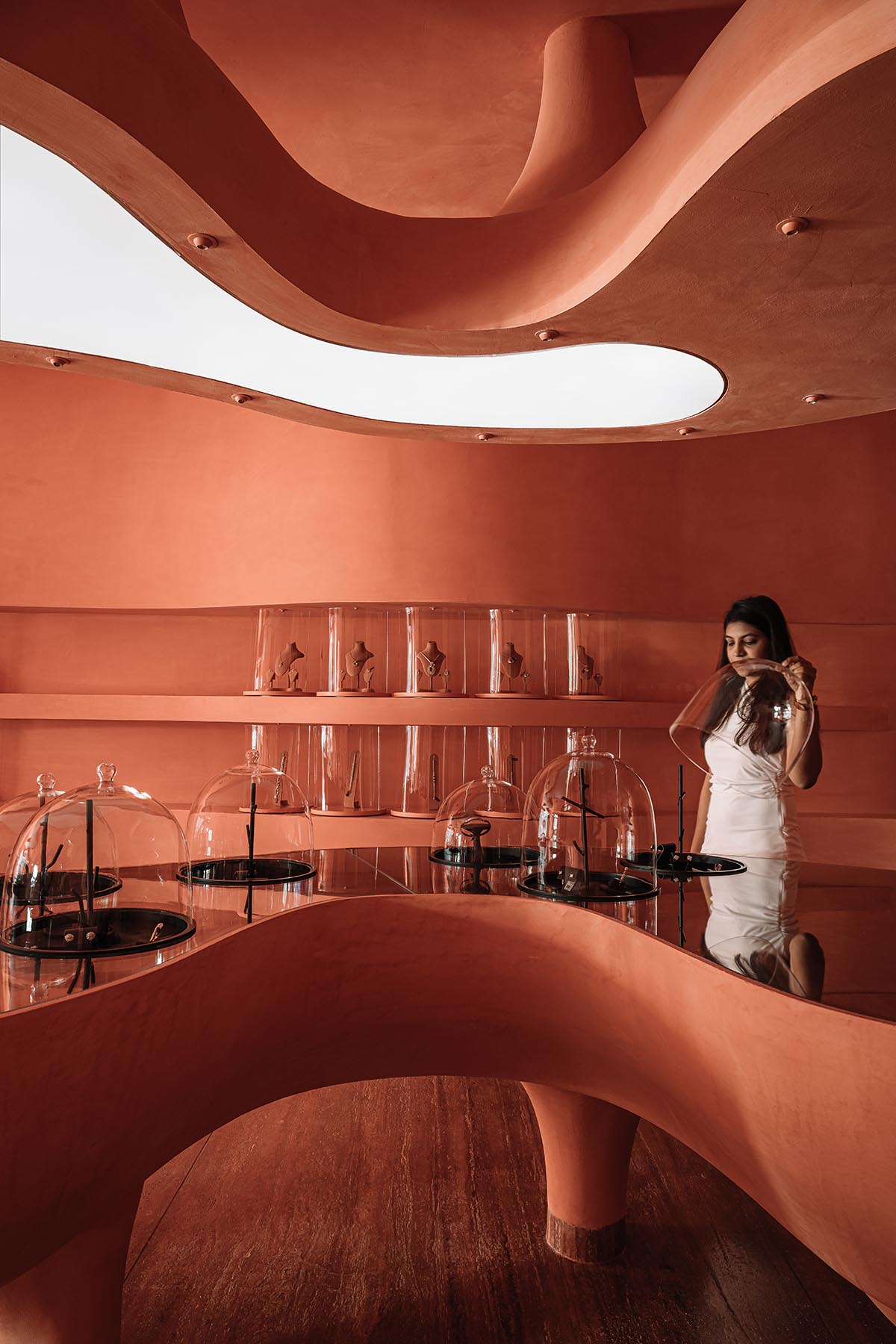 Indian jewellery boutique by MuseLAB features terracotta-doused interiors creating a sinuous island