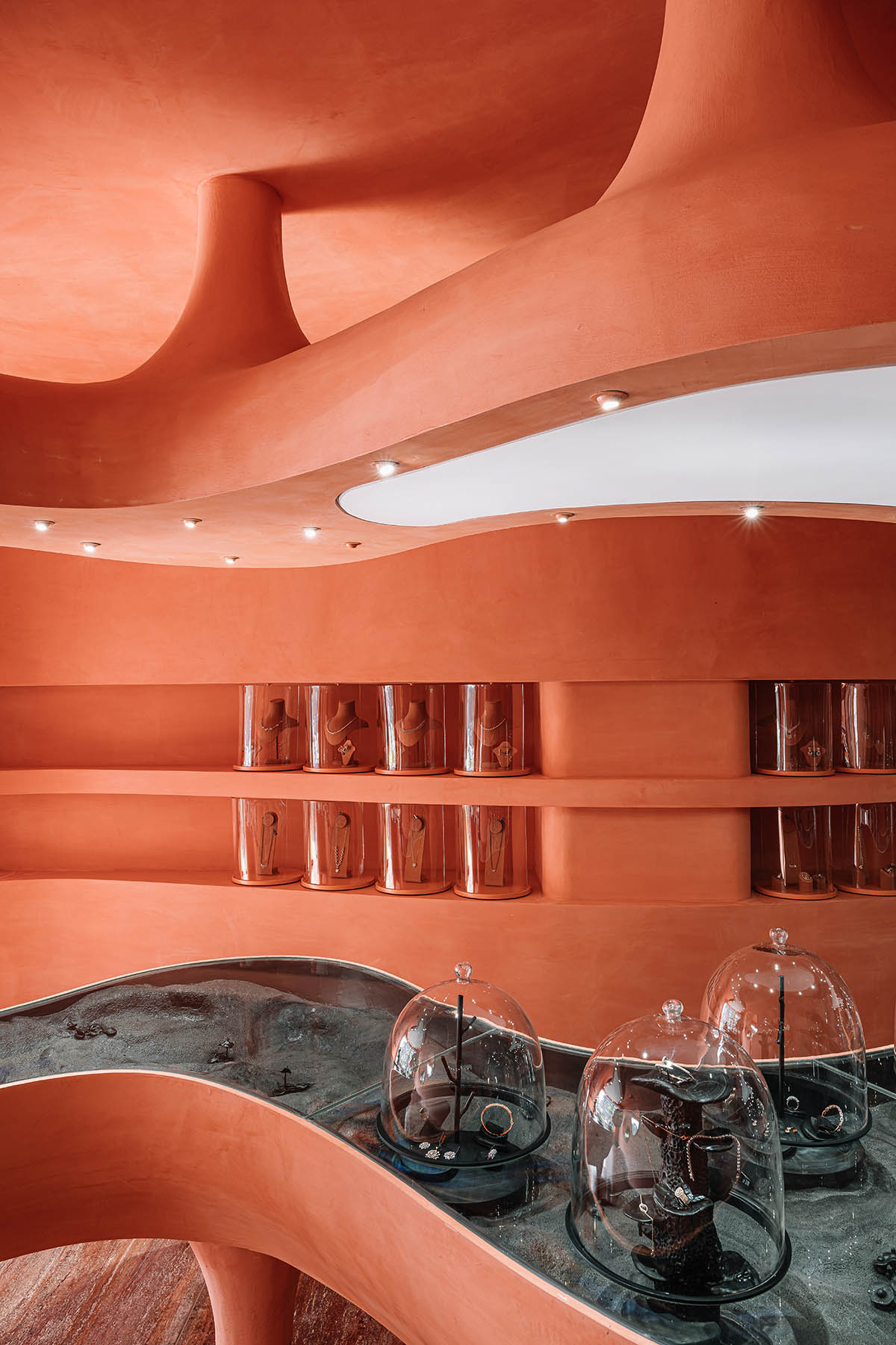 Indian jewellery boutique by MuseLAB features terracotta-doused interiors creating a sinuous island