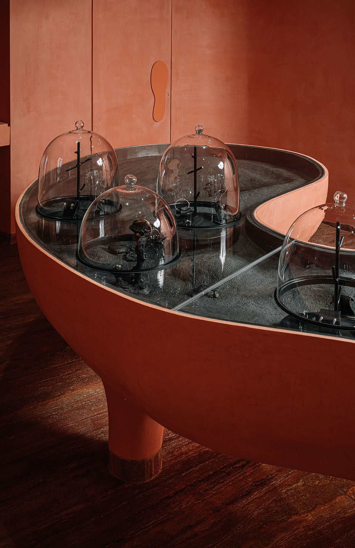 Indian jewellery boutique by MuseLAB features terracotta-doused interiors creating a sinuous island
