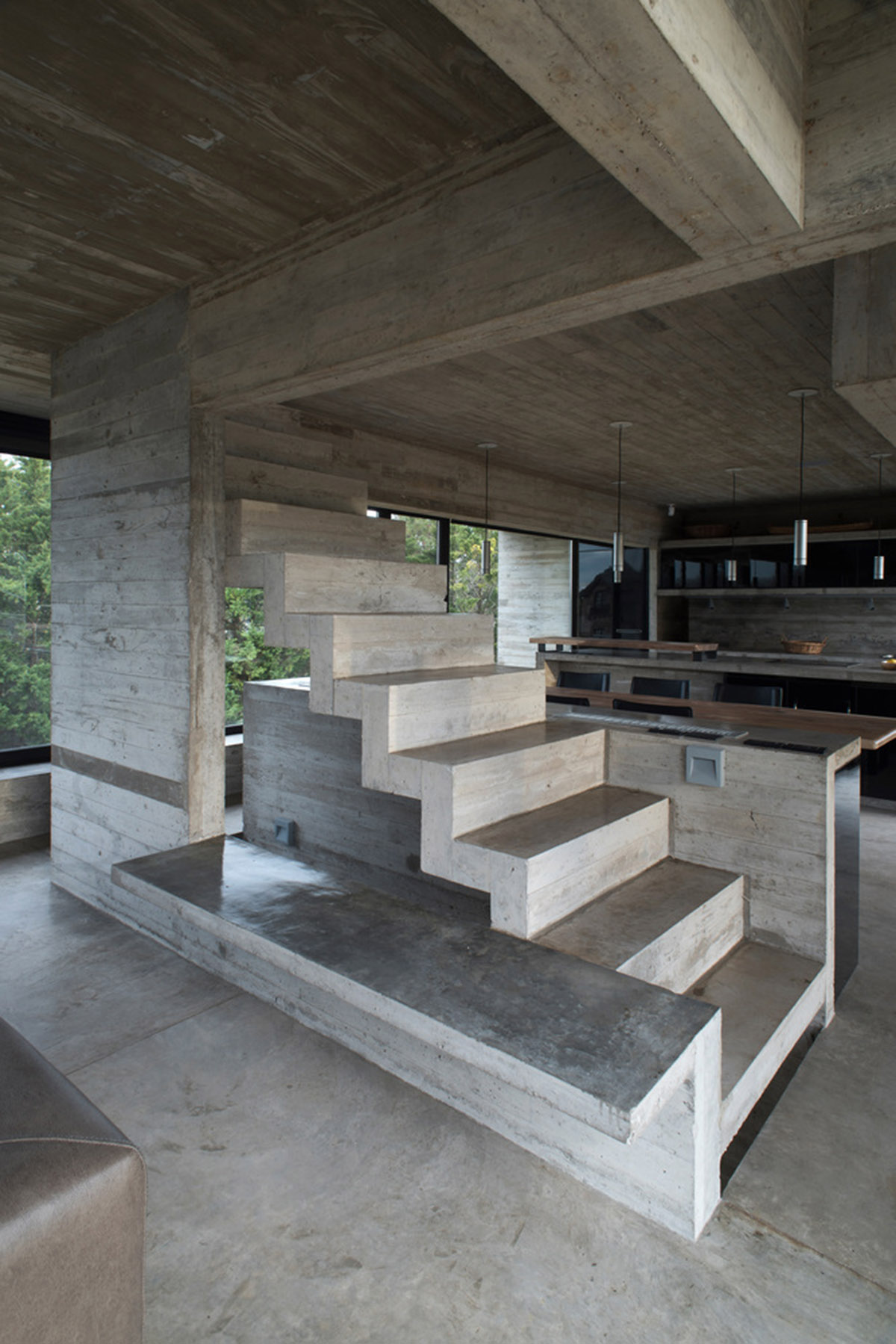 Luciano Kruk uses hanging volume for a vacation house supported by triangular column in Argentina