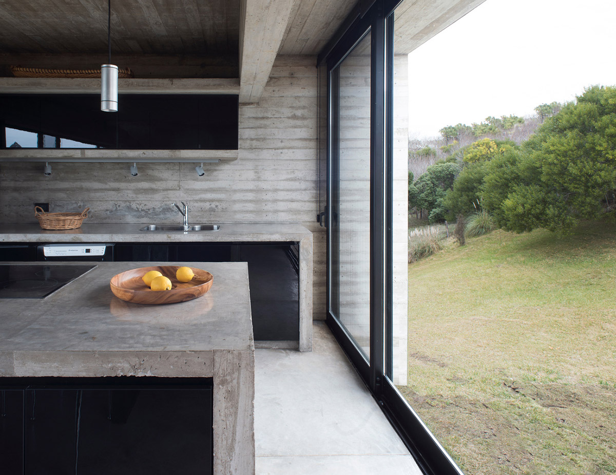 Luciano Kruk uses hanging volume for a vacation house supported by triangular column in Argentina