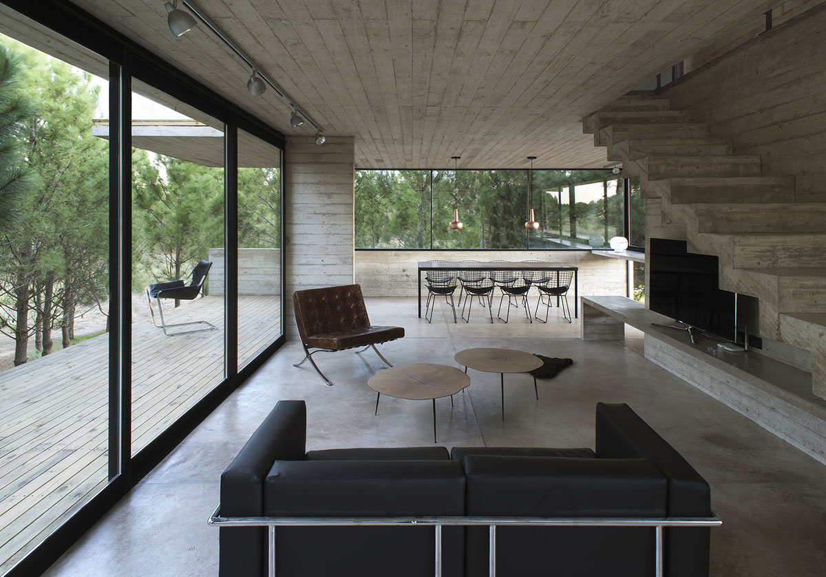 Luciano Kruk's concrete holiday home floats on a plinth and connects swimming pool with terrace