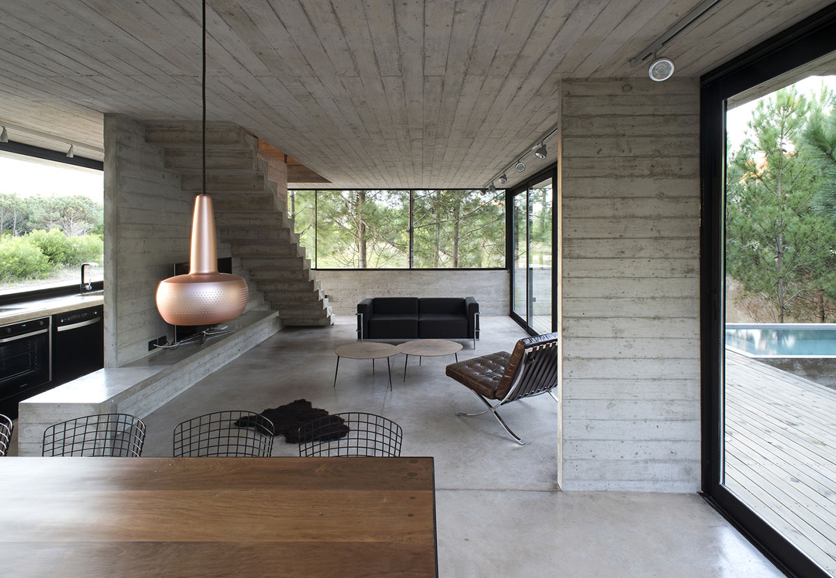 Luciano Kruk's concrete holiday home floats on a plinth and connects swimming pool with terrace