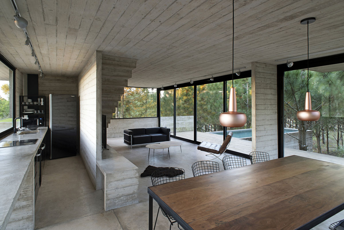 Luciano Kruk's concrete holiday home floats on a plinth and connects swimming pool with terrace