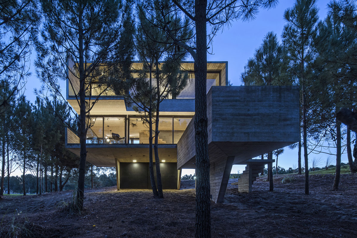 Luciano Kruk's concrete holiday home floats on a plinth and connects swimming pool with terrace