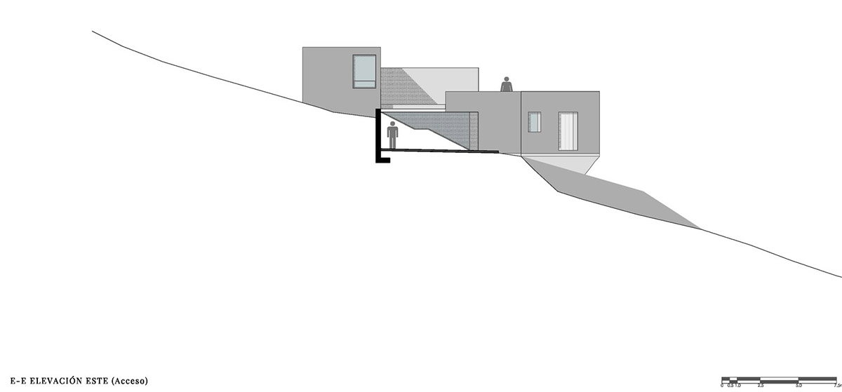 P+0 Arquitectura designs residence mixed with concrete and stone volumes on a complex terrain