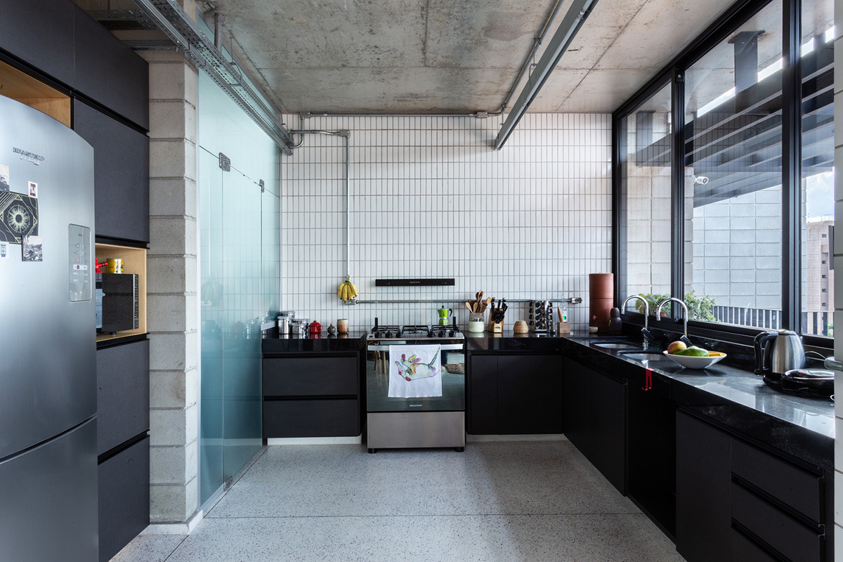 Large wooden shutters allow fully daylight in this house by Marcos Franchini & Nattalia Bom Conselho