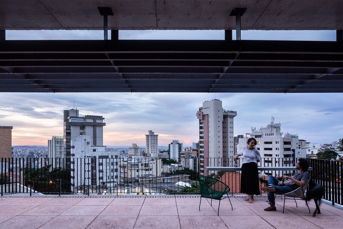 Large wooden shutters allow fully daylight in this house by Marcos Franchini & Nattalia Bom Conselho